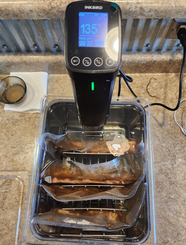INKBIRD Sous Vide Machine Cooking Four Meats at Once