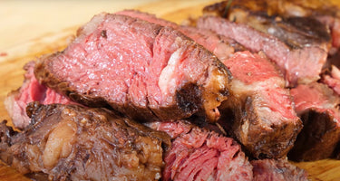 Sliced Ribeye Steak on Cutting Board