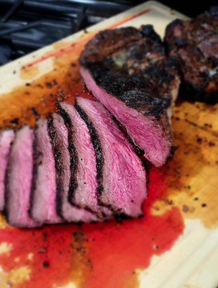 Sous Vide Medium-Rare Steak Sitting on Cutting Board